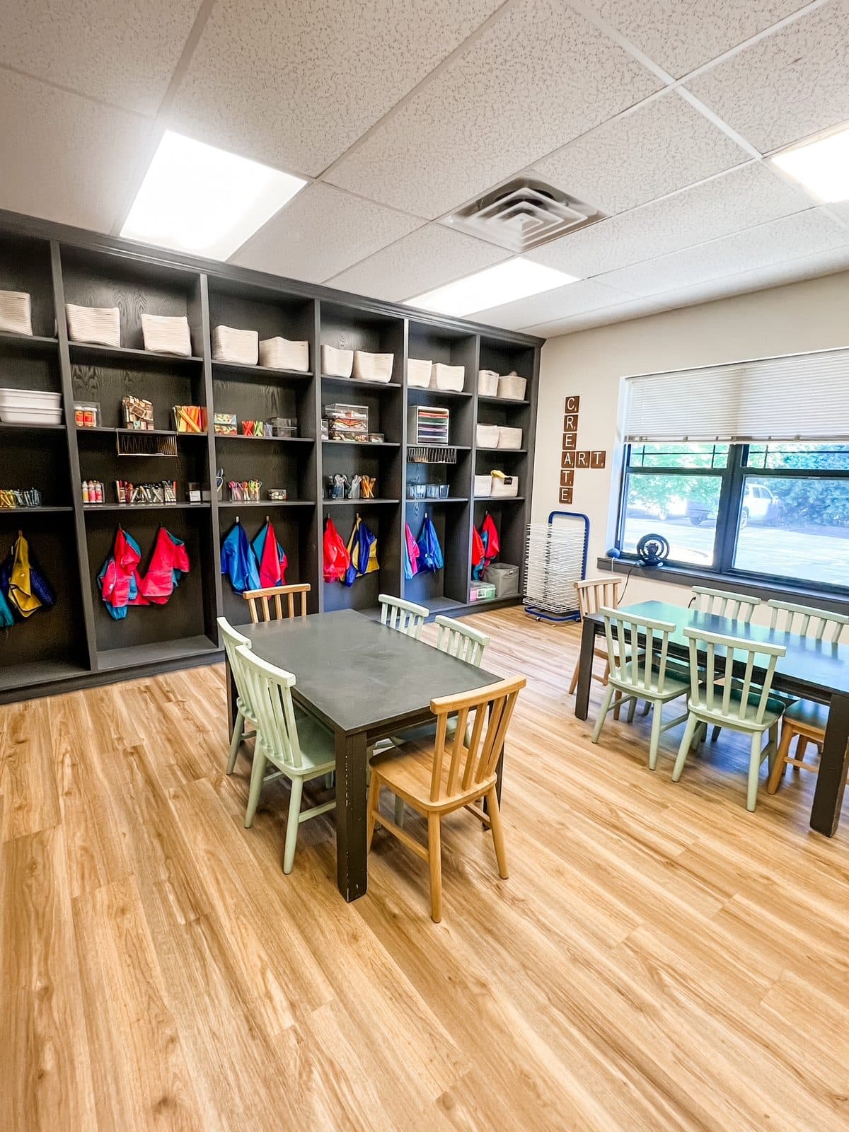 Art supplies, shelves and child-sized tables in the art room at Latitude's Bridgeton ABA center