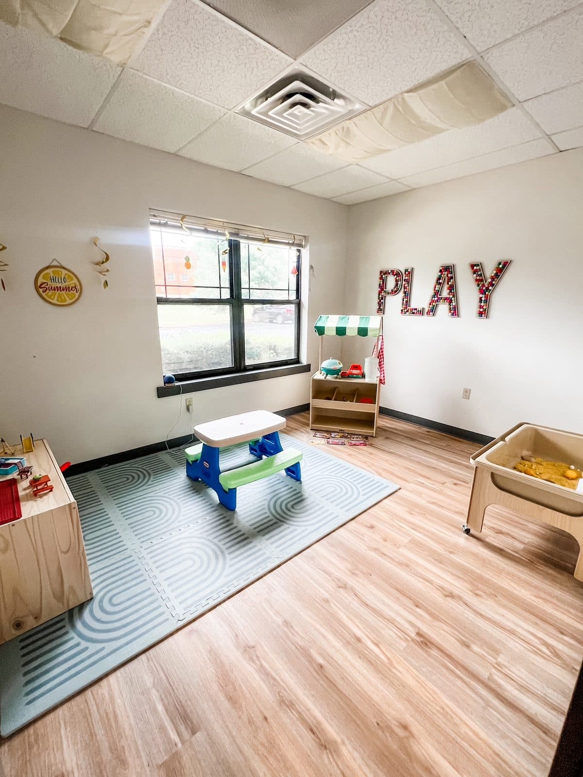 Play room with a picnic table and pretend market at Latitude's Bridgeton ABA center
